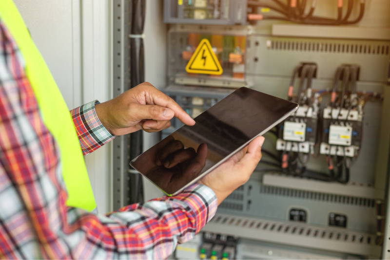 Contractors hands on a tablet
